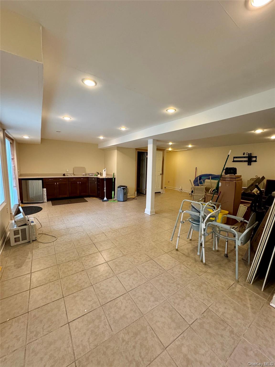 886 Sound Shore Road Riverhead, NY 11901 - Photo 38 of 39 Basement with sliding glass doors to the patio/pool