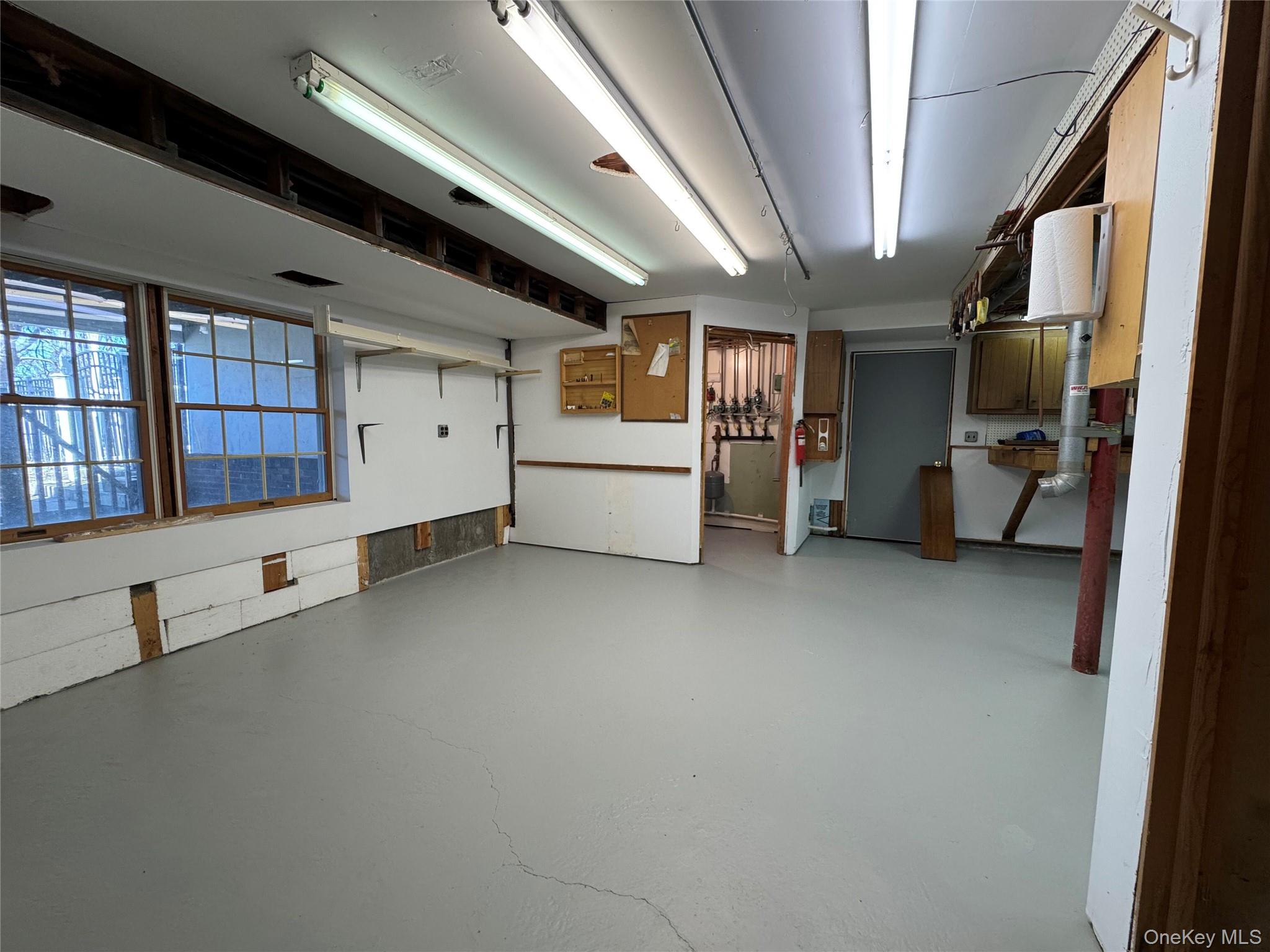 886 Sound Shore Road Riverhead, NY 11901 - Photo 39 of 39 Basement workshop with central vac and outside entrance