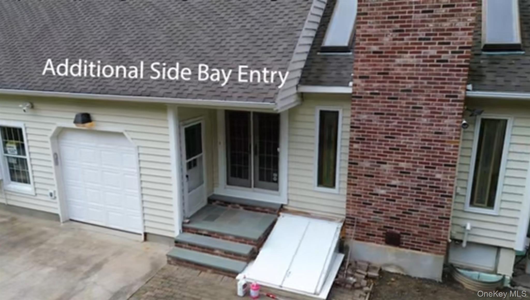 886 Sound Shore Road Riverhead, NY 11901 - Photo 4 of 39 Third garage bay on the side of the house