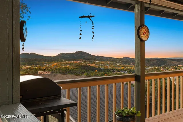 a view of a dining room with furniture wooden floor and chandelier