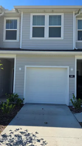 a view of a house with a street