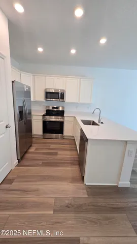 a view of a backyard with swimming pool