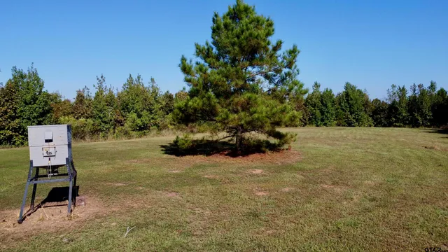 an aerial view of a house with yard swimming pool and outdoor seating