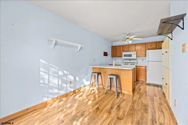 a kitchen with stainless steel appliances granite countertop a stove and a microwave