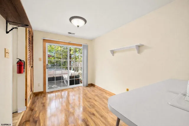 a spacious bedroom with a bed and a window