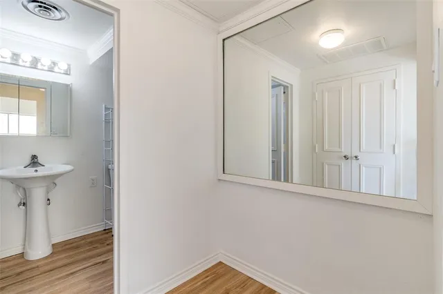 a white bath tub sitting next to a white sink