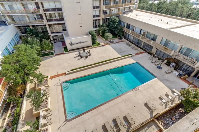 a view of a chairs and table in th patio
