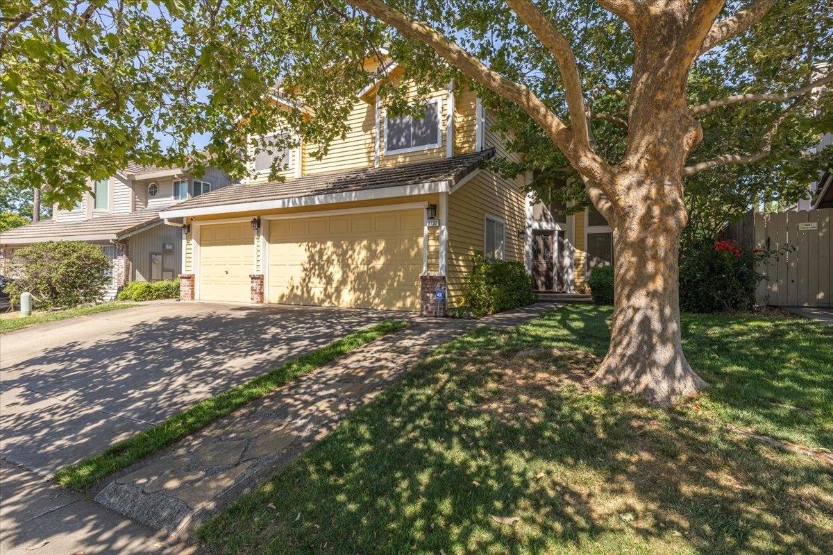a view of a house with a tree