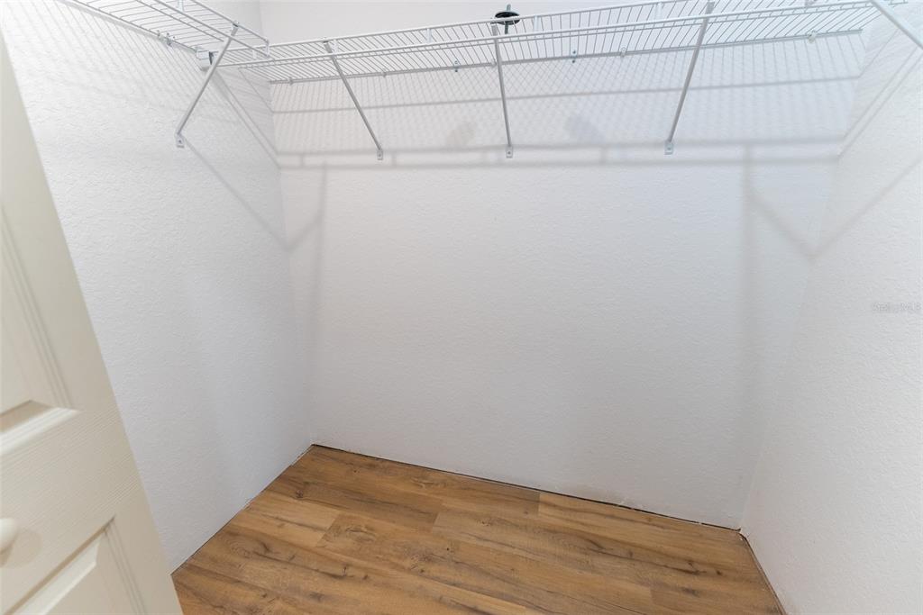 5497 Southwest 151 Street Road Ocala, FL 34473 - Photo 39 of 65 a view of a room with racks on the wall