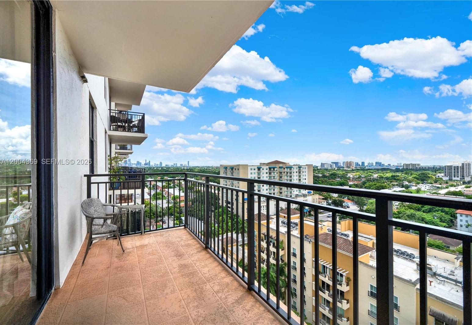 888 Douglas Road, Unit 1512 Coral Gables, FL 33134 - Photo 2 of 12 a view of city from a balcony