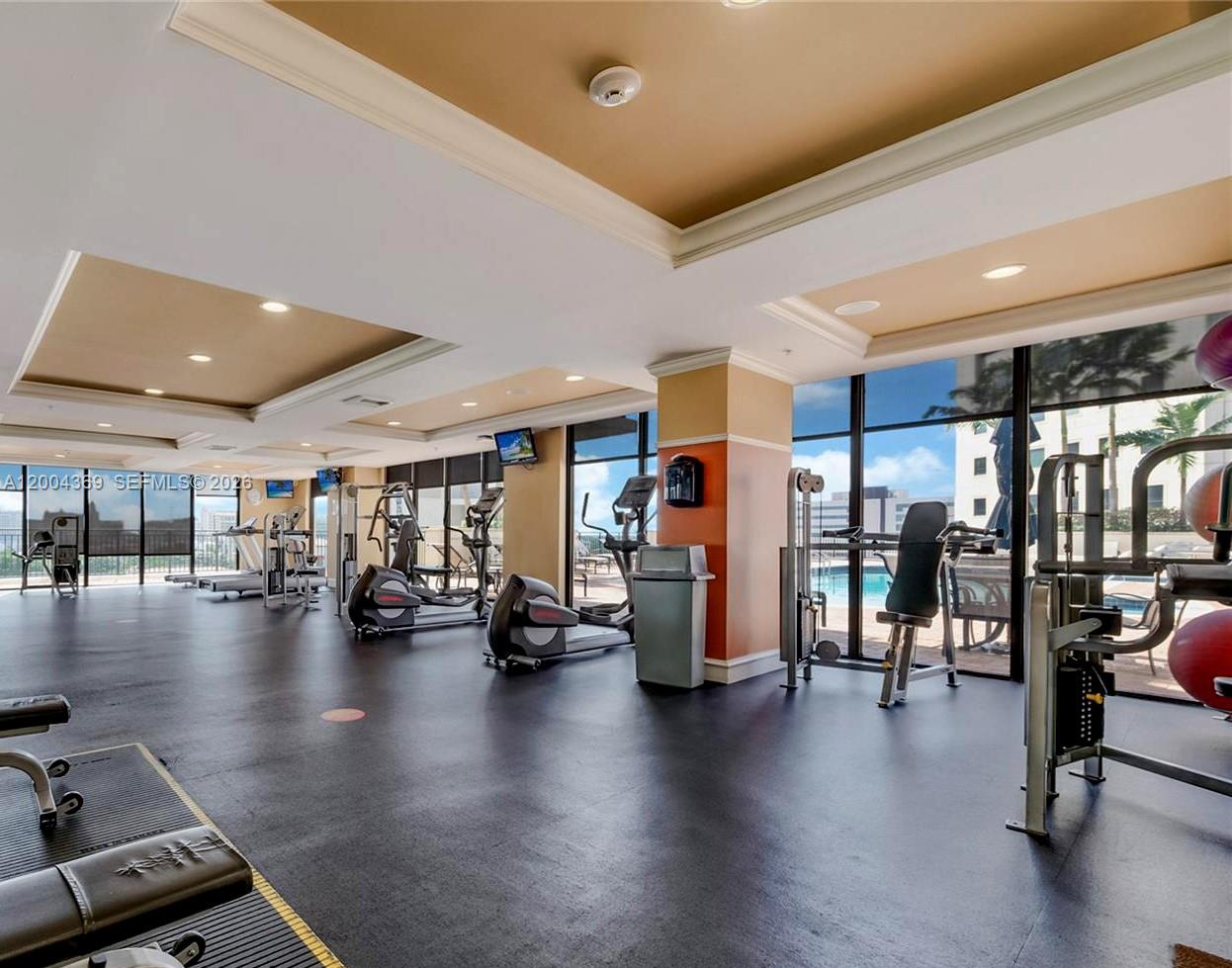 888 Douglas Road, Unit 1512 Coral Gables, FL 33134 - Photo 10 of 12 a view of a room with gym equipment