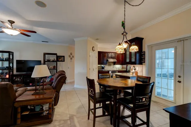 a view of a dining room with furniture and window