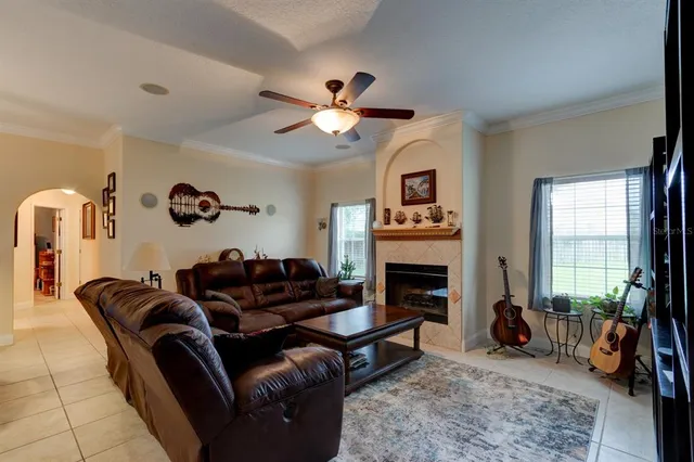 a living room with furniture and a fireplace
