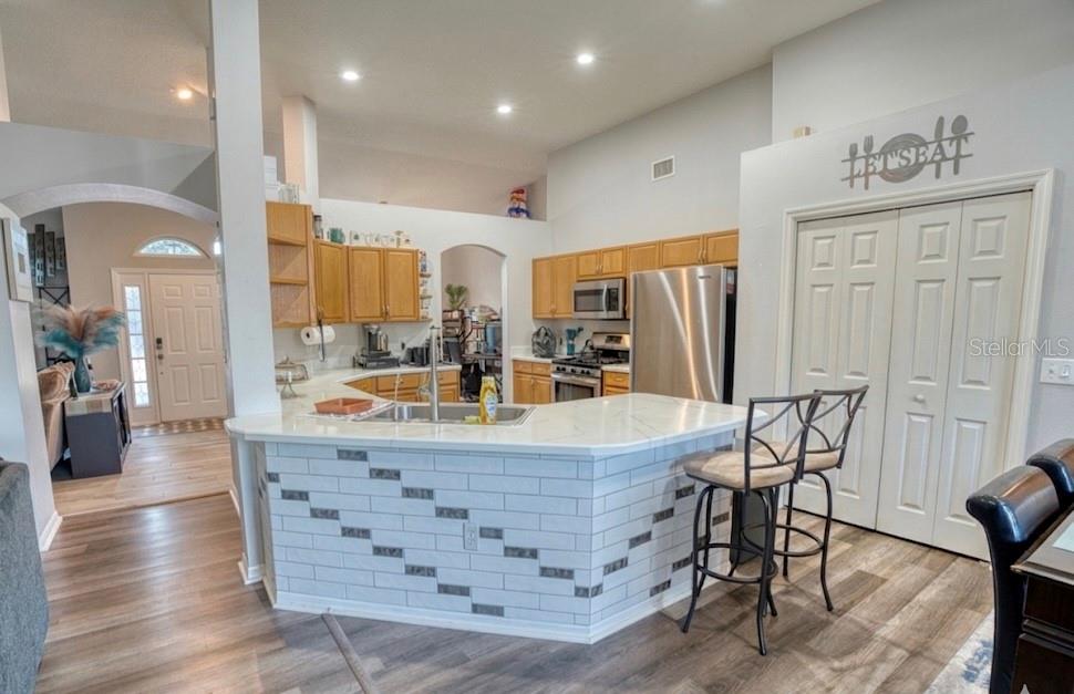 4303 Orange Ridge Court Valrico, FL 33596 - Photo 22 of 40 a large kitchen with a table and chairs