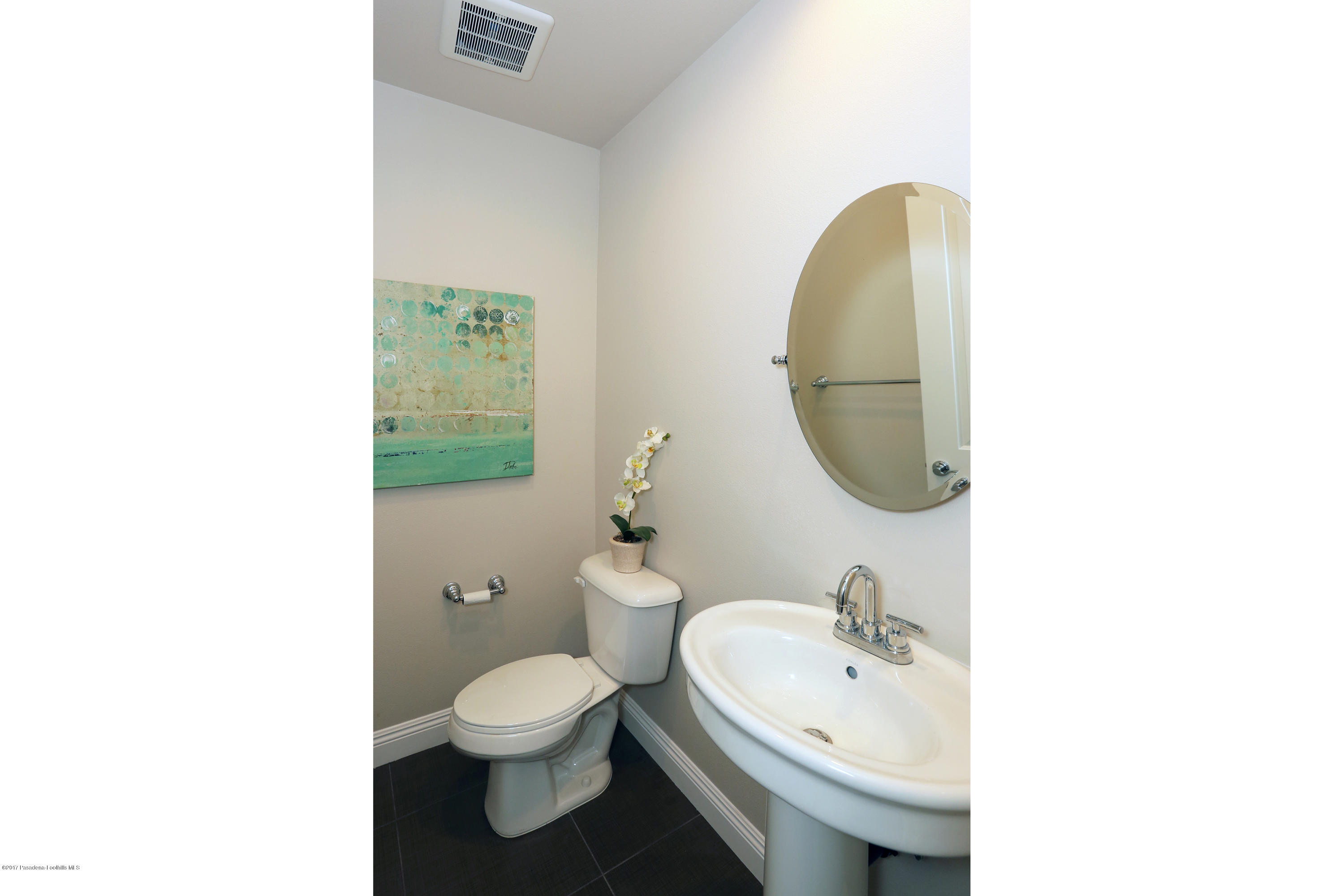 803 Arcadia Avenue, Unit A Arcadia, CA 91007 - Photo 11 of 42 a bathroom with a sink a toilet and a mirror