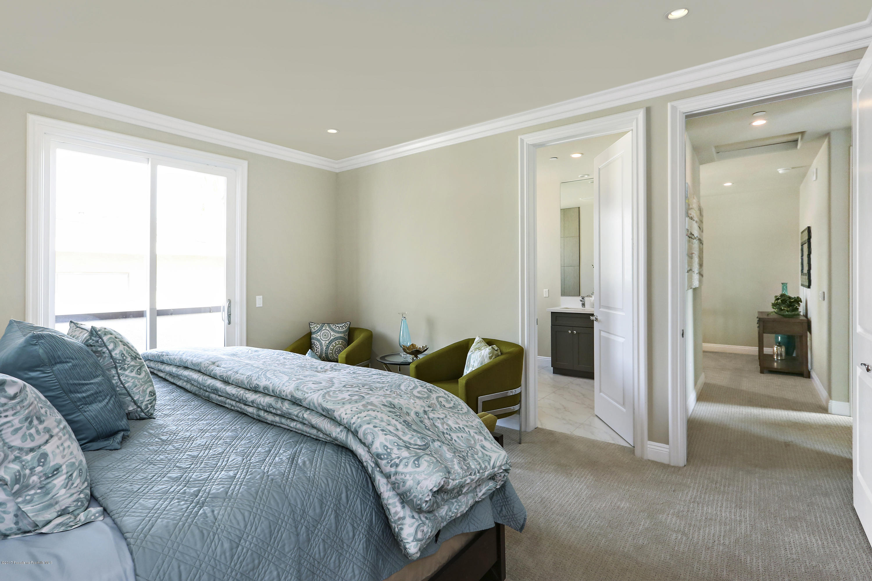 803 Arcadia Avenue, Unit A Arcadia, CA 91007 - Photo 13 of 42 a bedroom with a bed and a chandelier