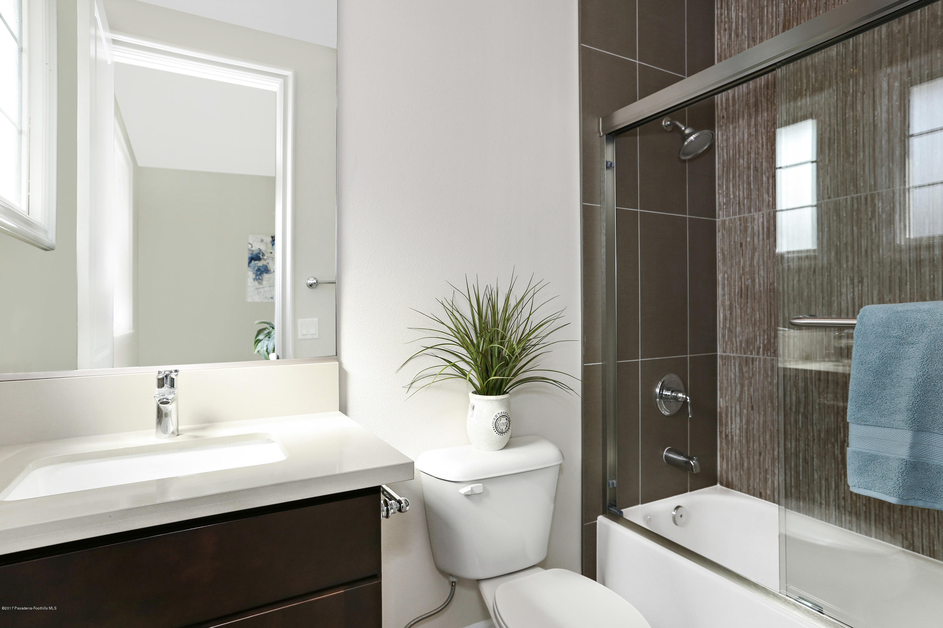 803 Arcadia Avenue, Unit A Arcadia, CA 91007 - Photo 19 of 42 a bathroom with a sink a toilet a mirror and shower