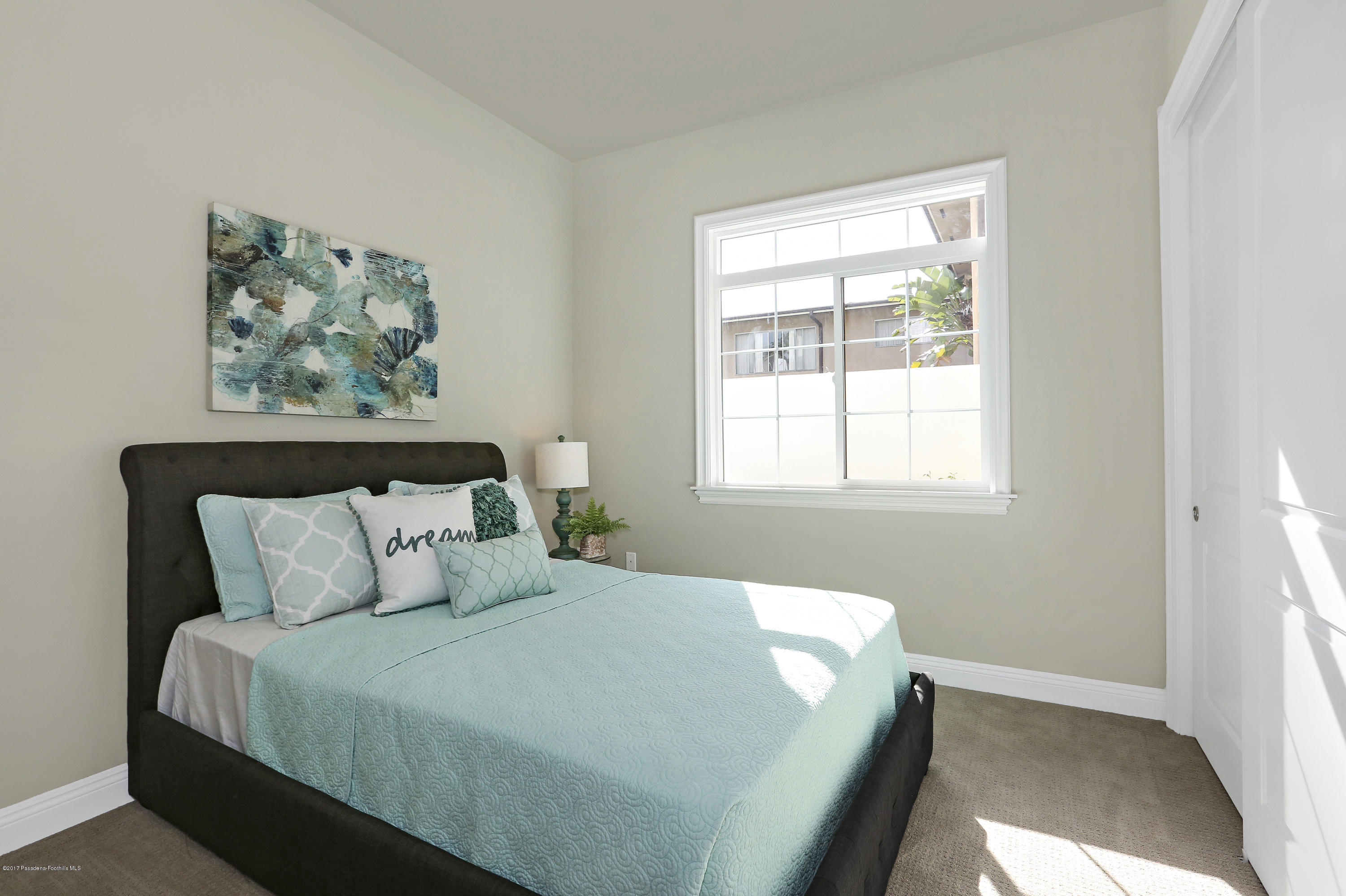 803 Arcadia Avenue, Unit A Arcadia, CA 91007 - Photo 9 of 42 a bedroom with a bed and a window
