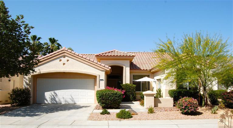 39495 Manorgate Road Palm Desert, CA 92211 - Photo 1 of 22 a front view of a house with a yard
