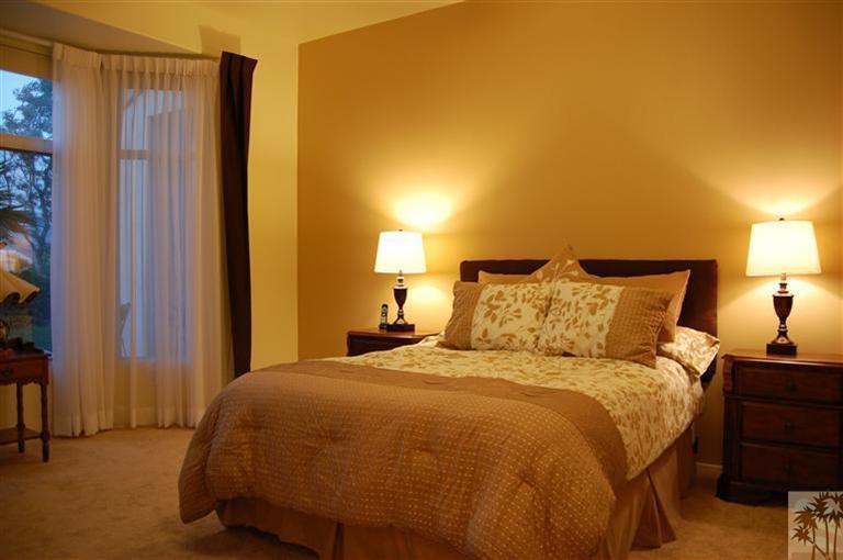 39495 Manorgate Road Palm Desert, CA 92211 - Photo 16 of 22 a bedroom with a bed and a night stand
