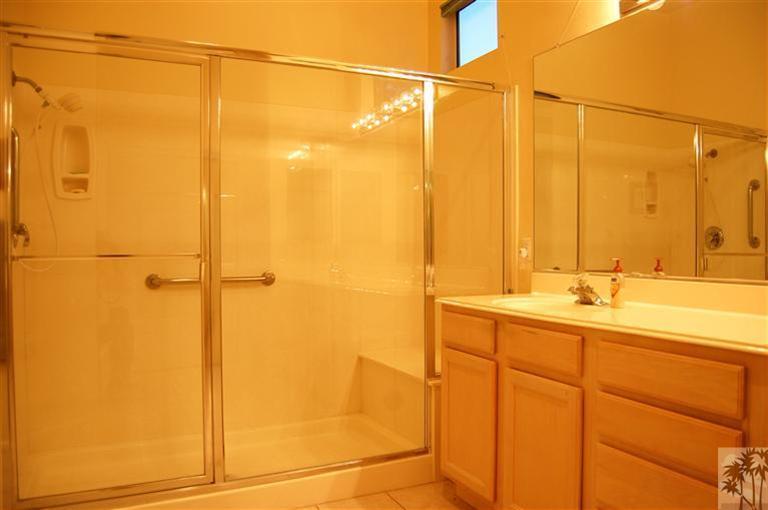 39495 Manorgate Road Palm Desert, CA 92211 - Photo 18 of 22 a bathroom with a shower and a sink