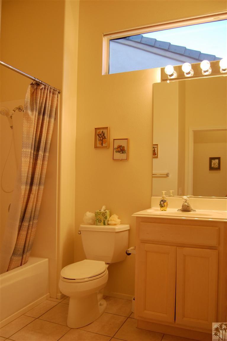 39495 Manorgate Road Palm Desert, CA 92211 - Photo 22 of 22 a bathroom with a sink a toilet and shower