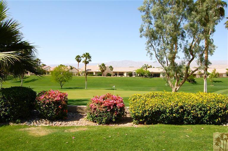 39495 Manorgate Road Palm Desert, CA 92211 - Photo 3 of 22 a view of a garden with a lake view