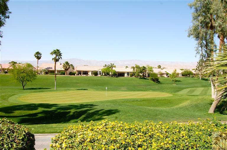39495 Manorgate Road Palm Desert, CA 92211 - Photo 5 of 22 a view of a golf course with a lake