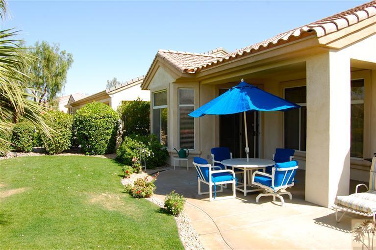 39495 Manorgate Road Palm Desert, CA 92211 - Photo 7 of 22 a view of a house with backyard porch and sitting area