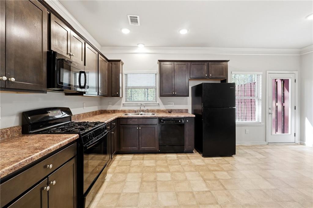 331 Turtle Creek Drive Winder, GA 30680 - Photo 12 of 25 a kitchen with a refrigerator and a sink