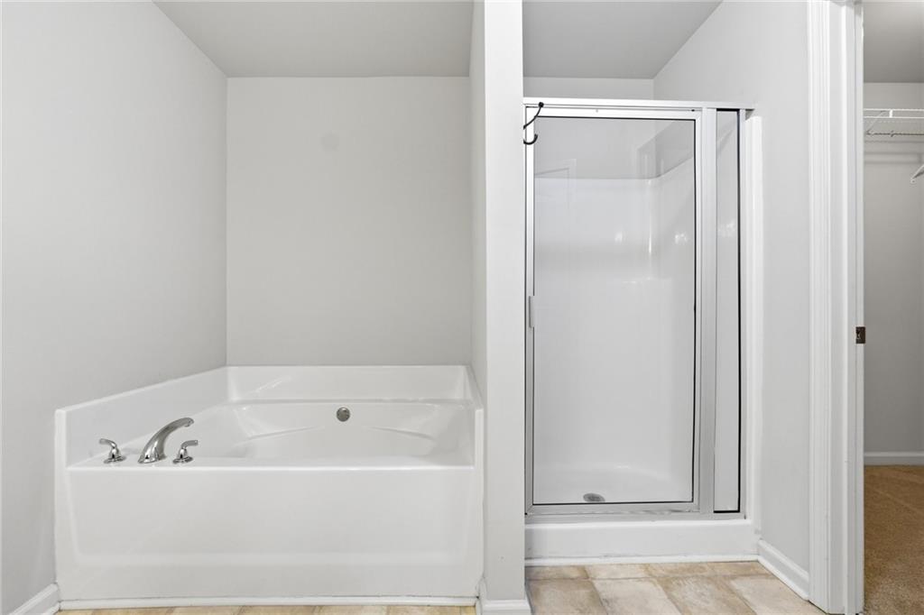 331 Turtle Creek Drive Winder, GA 30680 - Photo 17 of 25 a bathroom with bathtub and shower