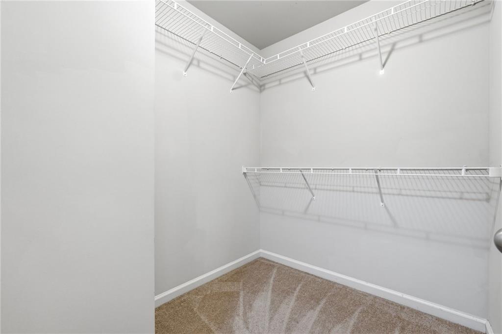 331 Turtle Creek Drive Winder, GA 30680 - Photo 18 of 25 a view of a room with racks on the wall