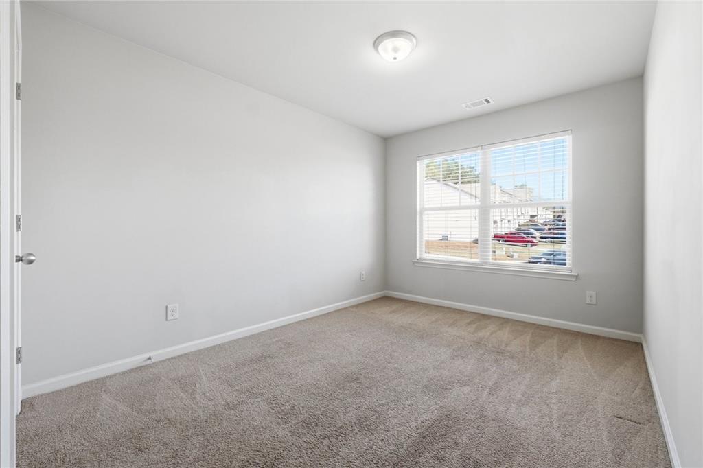 331 Turtle Creek Drive Winder, GA 30680 - Photo 19 of 25 an empty room with windows