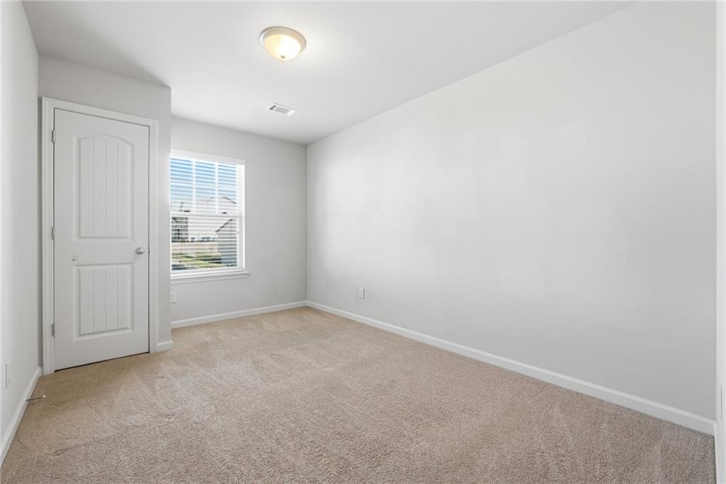 331 Turtle Creek Drive Winder, GA 30680 - Photo 20 of 25 an empty room with windows and closet