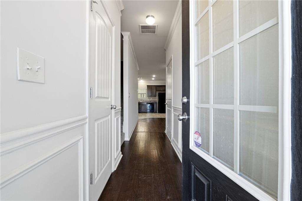 331 Turtle Creek Drive Winder, GA 30680 - Photo 2 of 25 a view of hallway with wooden floor and staircase