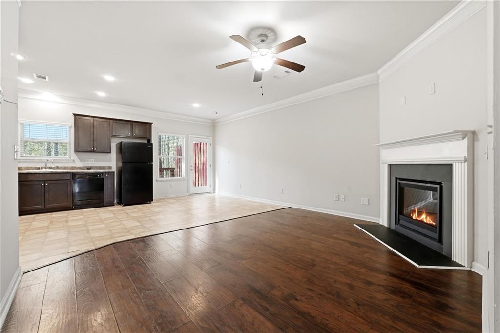 331 Turtle Creek Drive Winder, GA 30680 - Photo 4 of 25 a view of an empty room with a fireplace and a ceiling fan