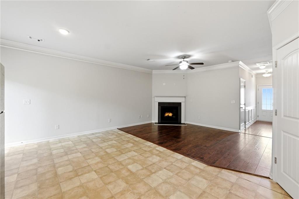 331 Turtle Creek Drive Winder, GA 30680 - Photo 8 of 25 a view of a livingroom with a ceiling fan a rug and a large window