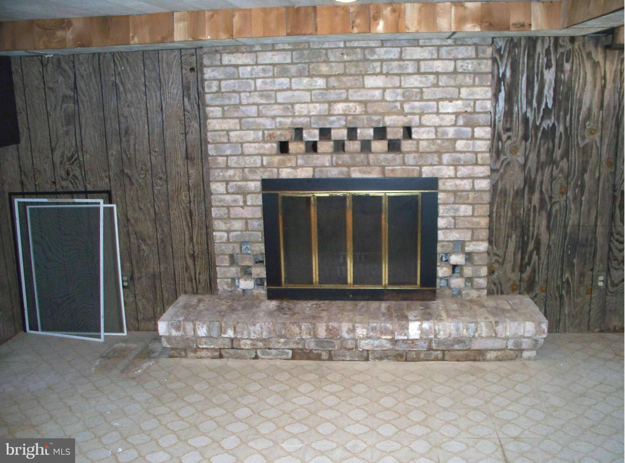 2213 Firethorn Road Middle River, MD 21220 - Photo 9 of 17 Wood burning FP in Rec Room