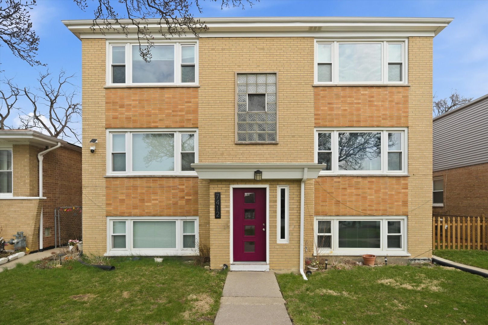 a front view of a house with a yard