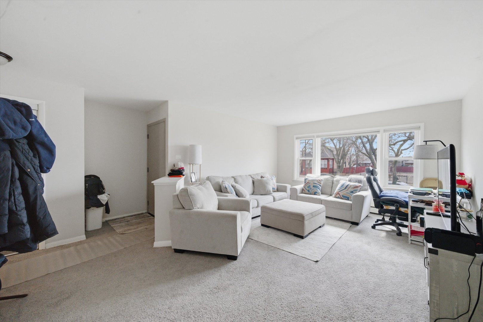 7412 West 63rd Place Summit, IL 60501 - Photo 11 of 49 a living room with furniture and a large window