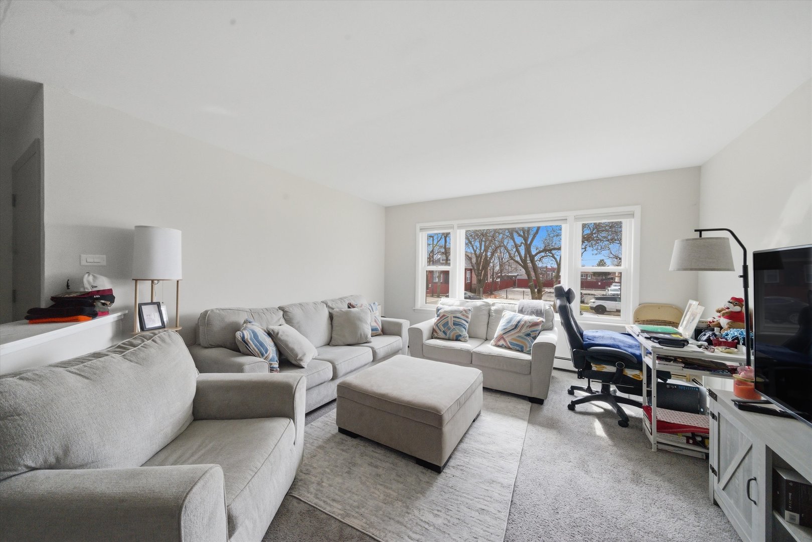 7412 West 63rd Place Summit, IL 60501 - Photo 12 of 49 a living room with furniture and a window