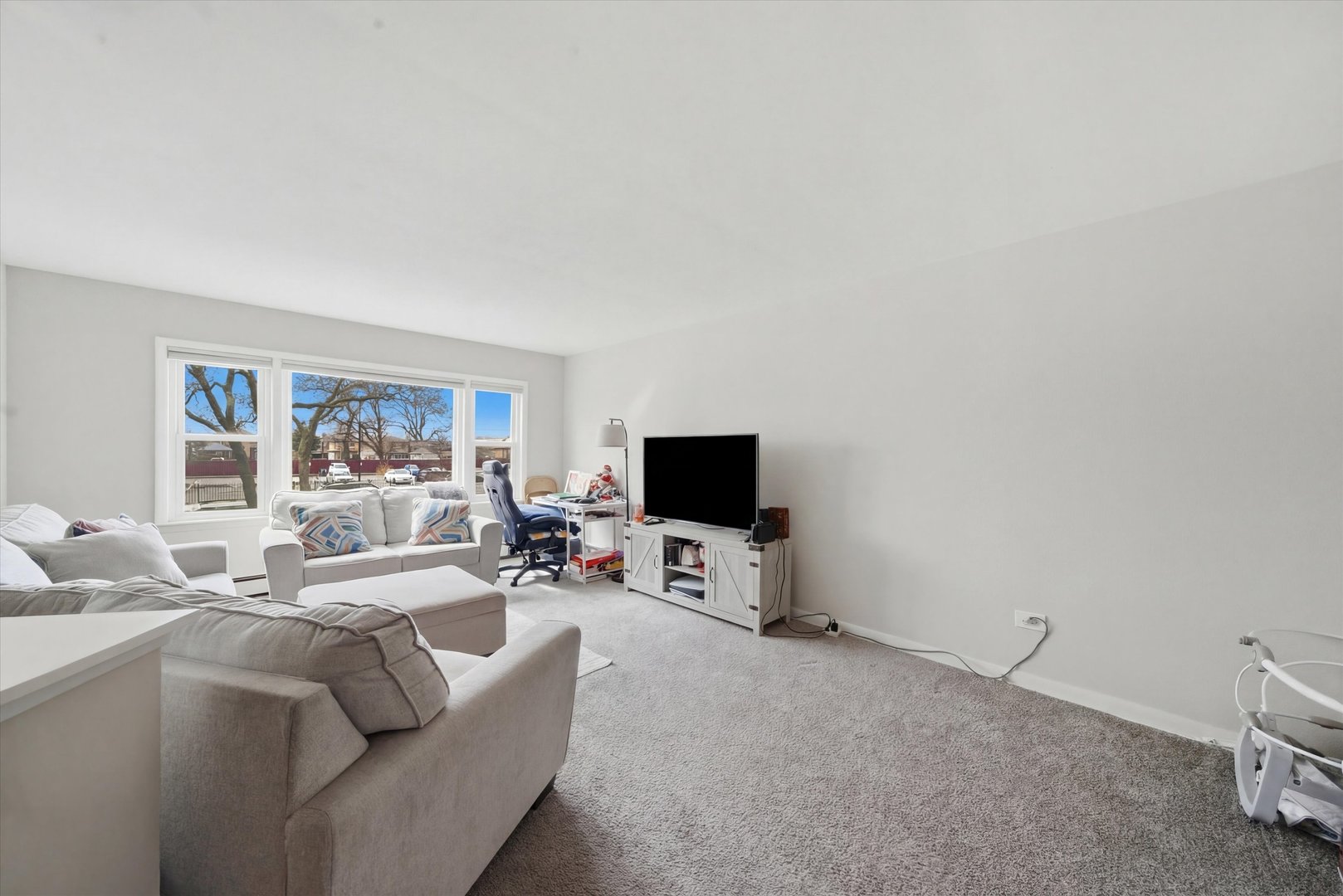 7412 West 63rd Place Summit, IL 60501 - Photo 13 of 49 a living room with furniture and a flat screen tv