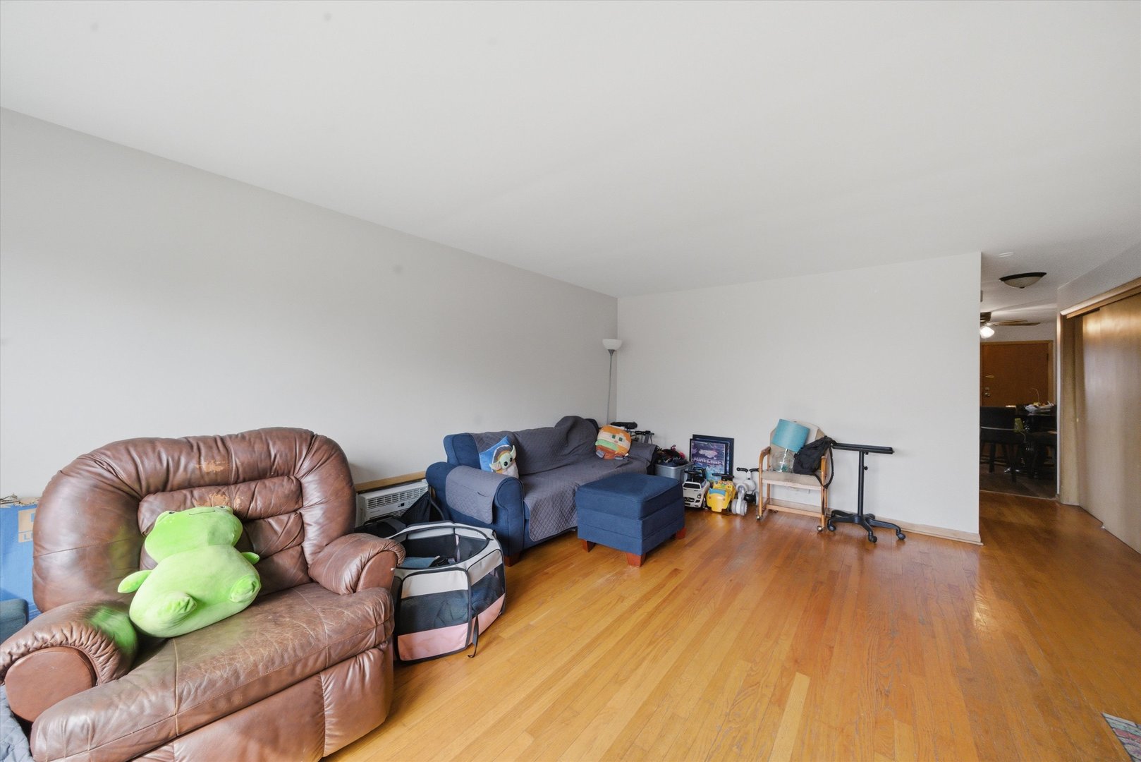 7412 West 63rd Place Summit, IL 60501 - Photo 14 of 49 a living room with furniture and wooden floor