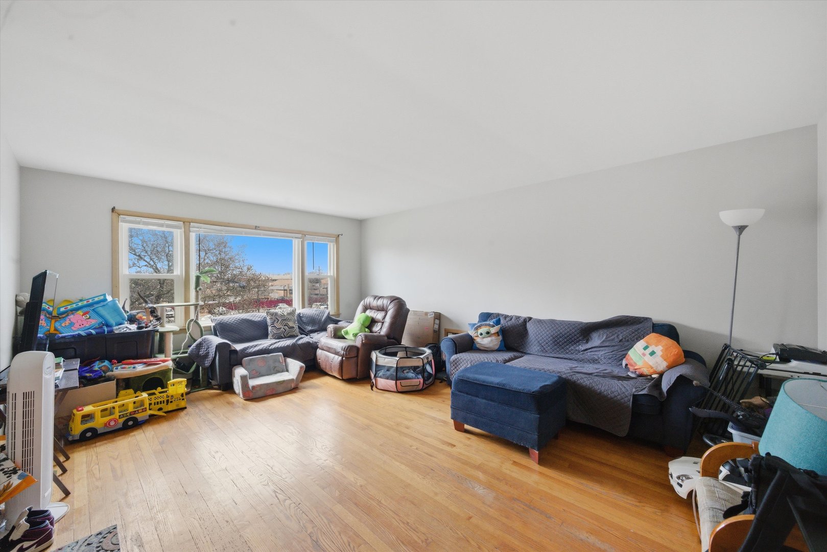 7412 West 63rd Place Summit, IL 60501 - Photo 15 of 49 a living room with furniture a window and a lamp