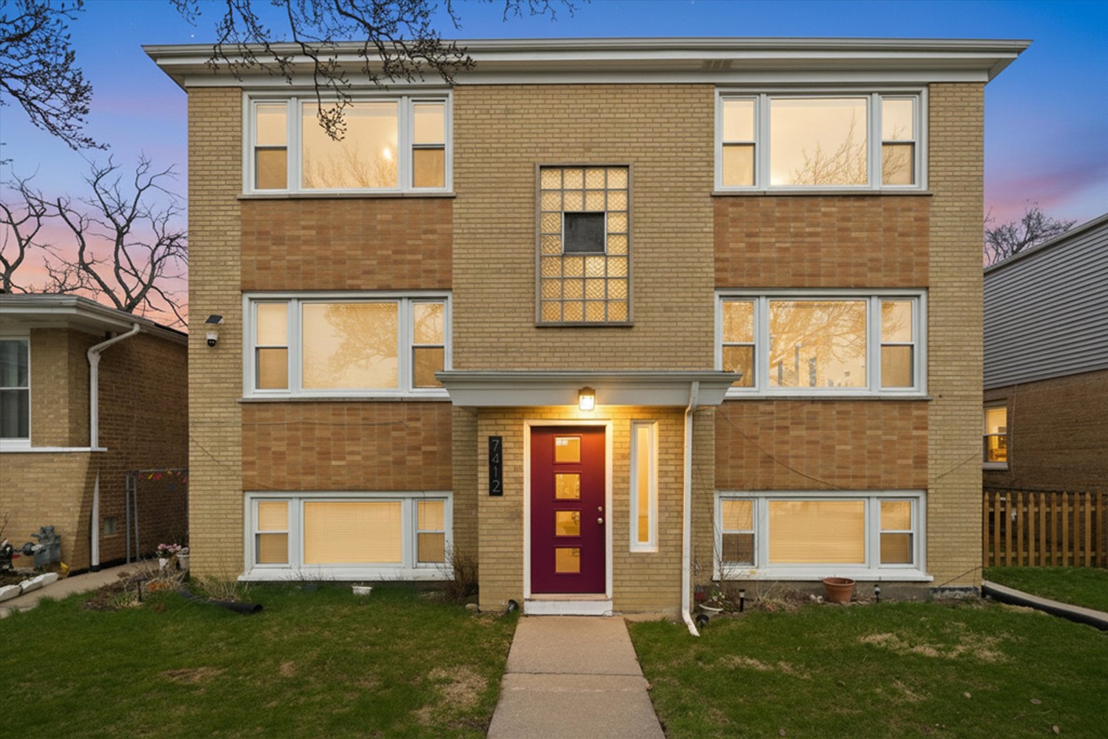 7412 West 63rd Place Summit, IL 60501 - Photo 2 of 49 a front view of a house with a yard