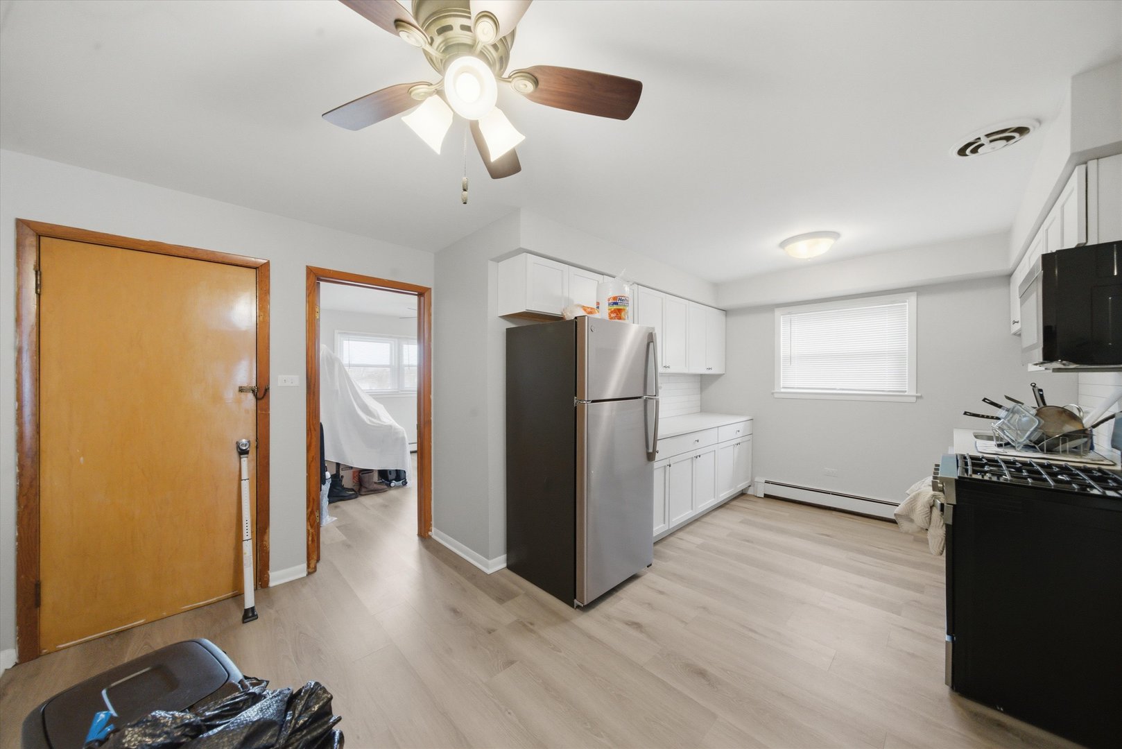 7412 West 63rd Place Summit, IL 60501 - Photo 23 of 49 a kitchen with stainless steel appliances granite countertop a refrigerator and a stove top oven