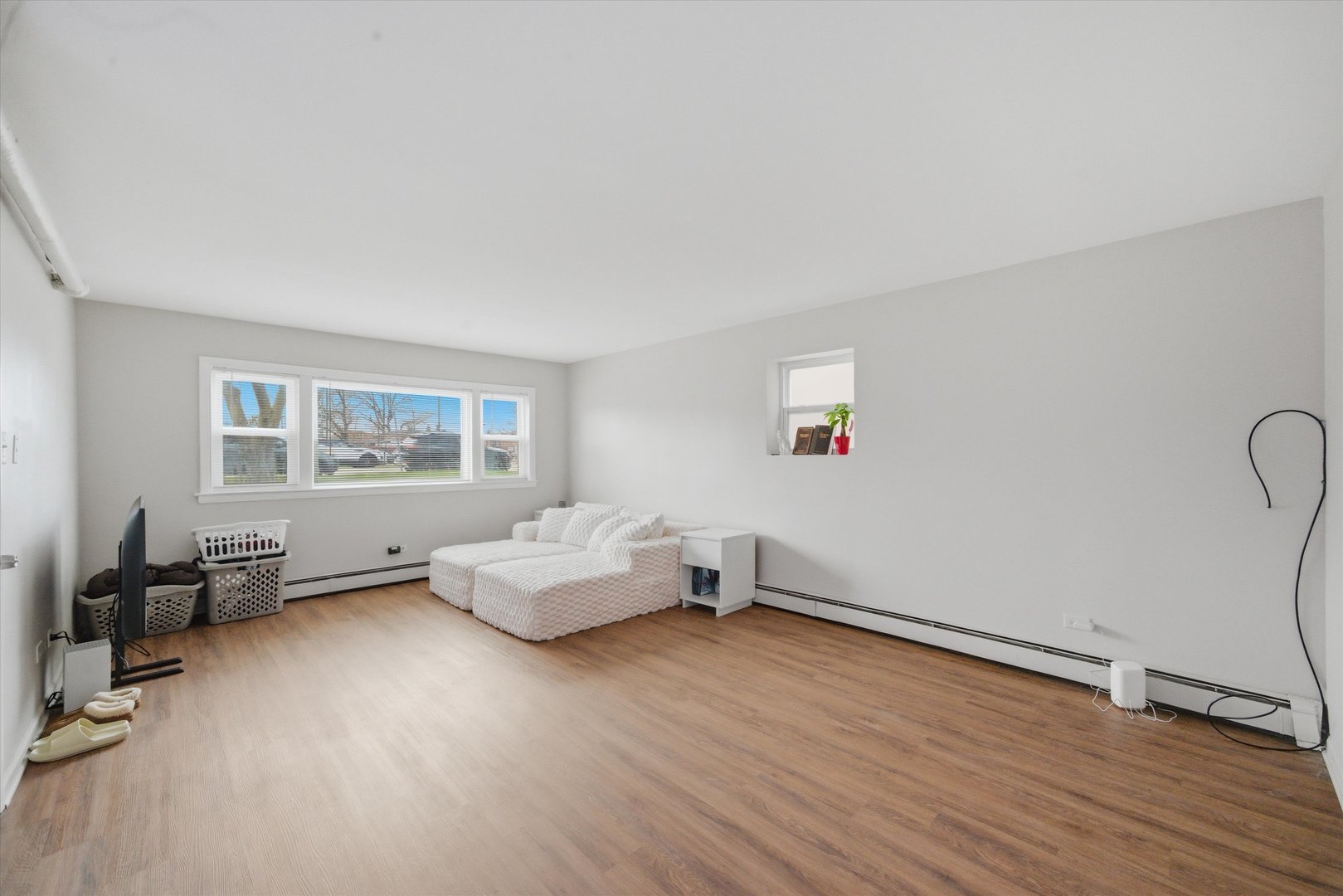7412 West 63rd Place Summit, IL 60501 - Photo 34 of 49 a living room with furniture and a window