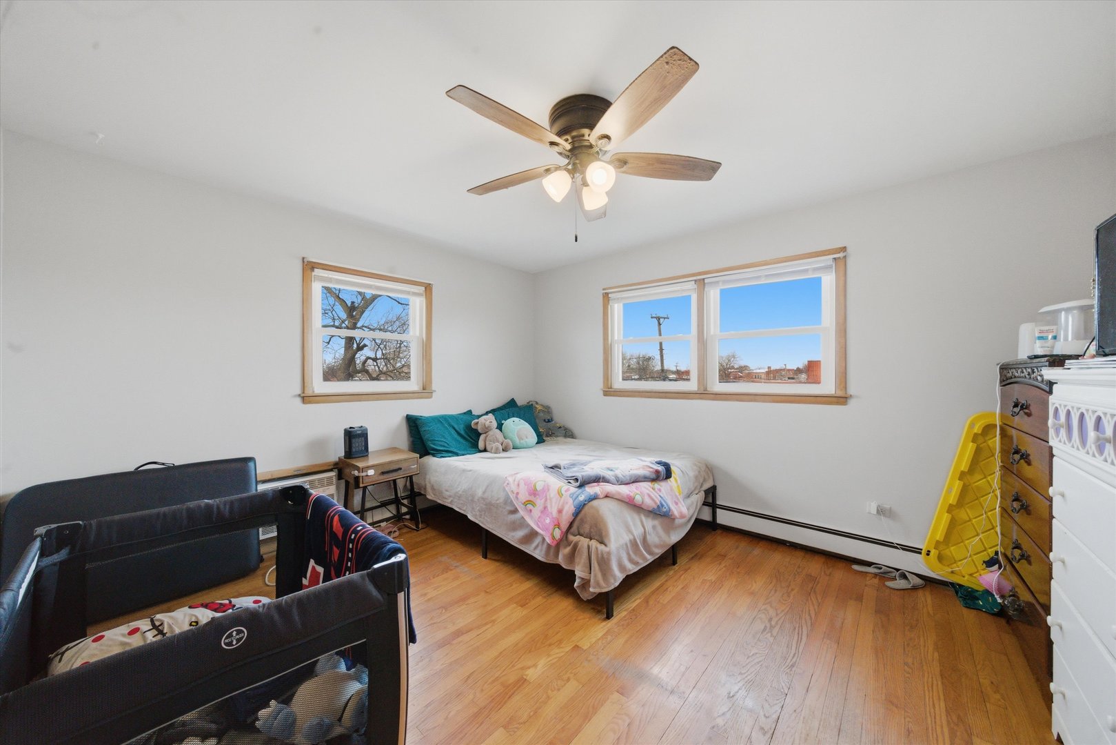 7412 West 63rd Place Summit, IL 60501 - Photo 37 of 49 a living room with bed furniture and a window