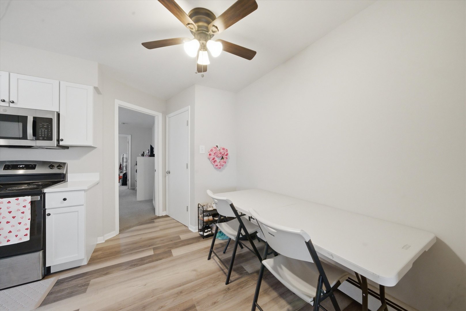 7412 West 63rd Place Summit, IL 60501 - Photo 5 of 49 a view of a dining room with furniture and chandelier