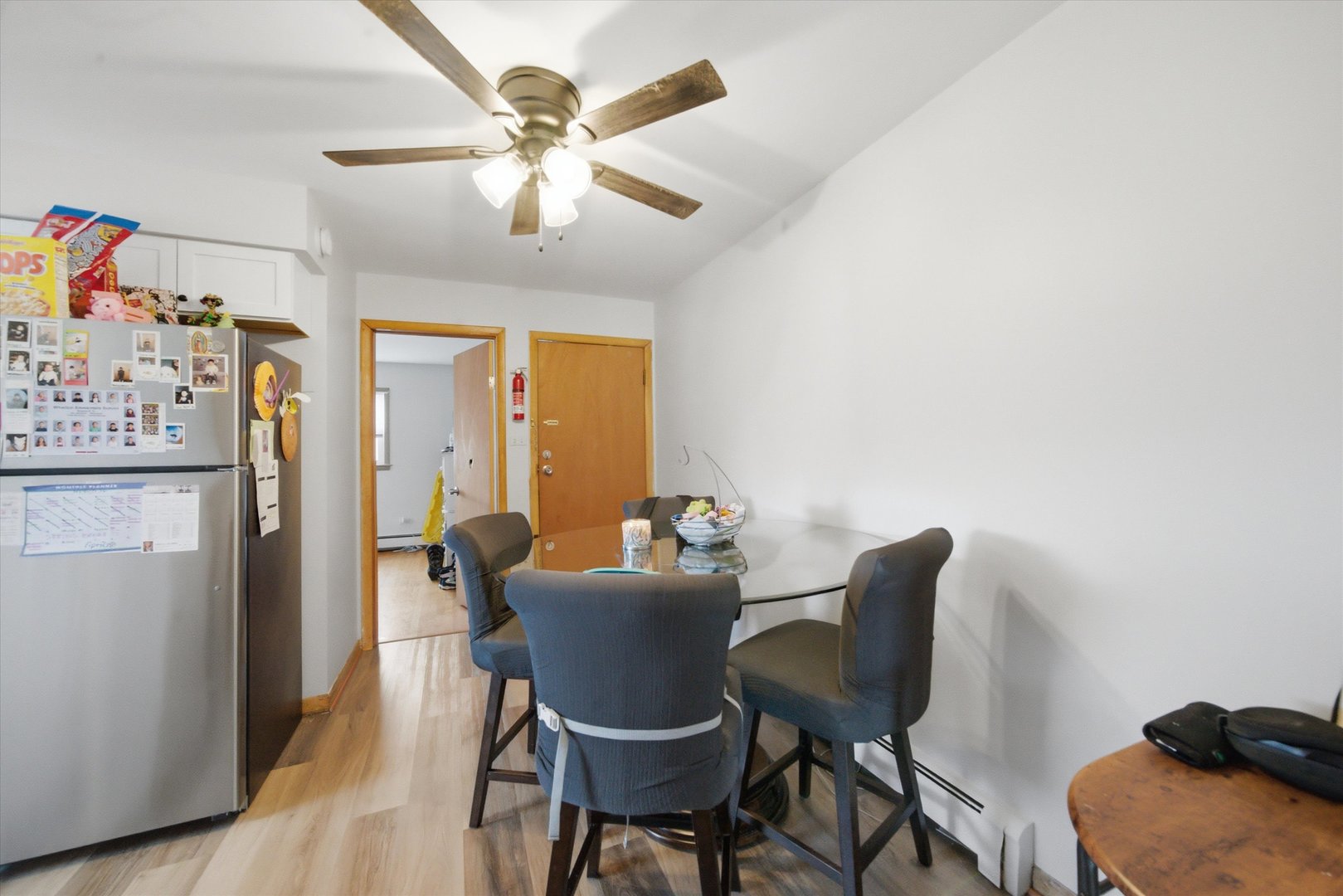 7412 West 63rd Place Summit, IL 60501 - Photo 6 of 49 a view of a dining room with furniture and a chandelier fan